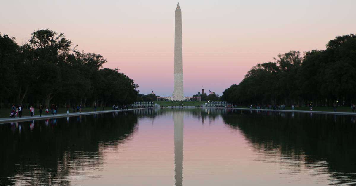 The Washington Monument at dusk over the Reflecting Pool