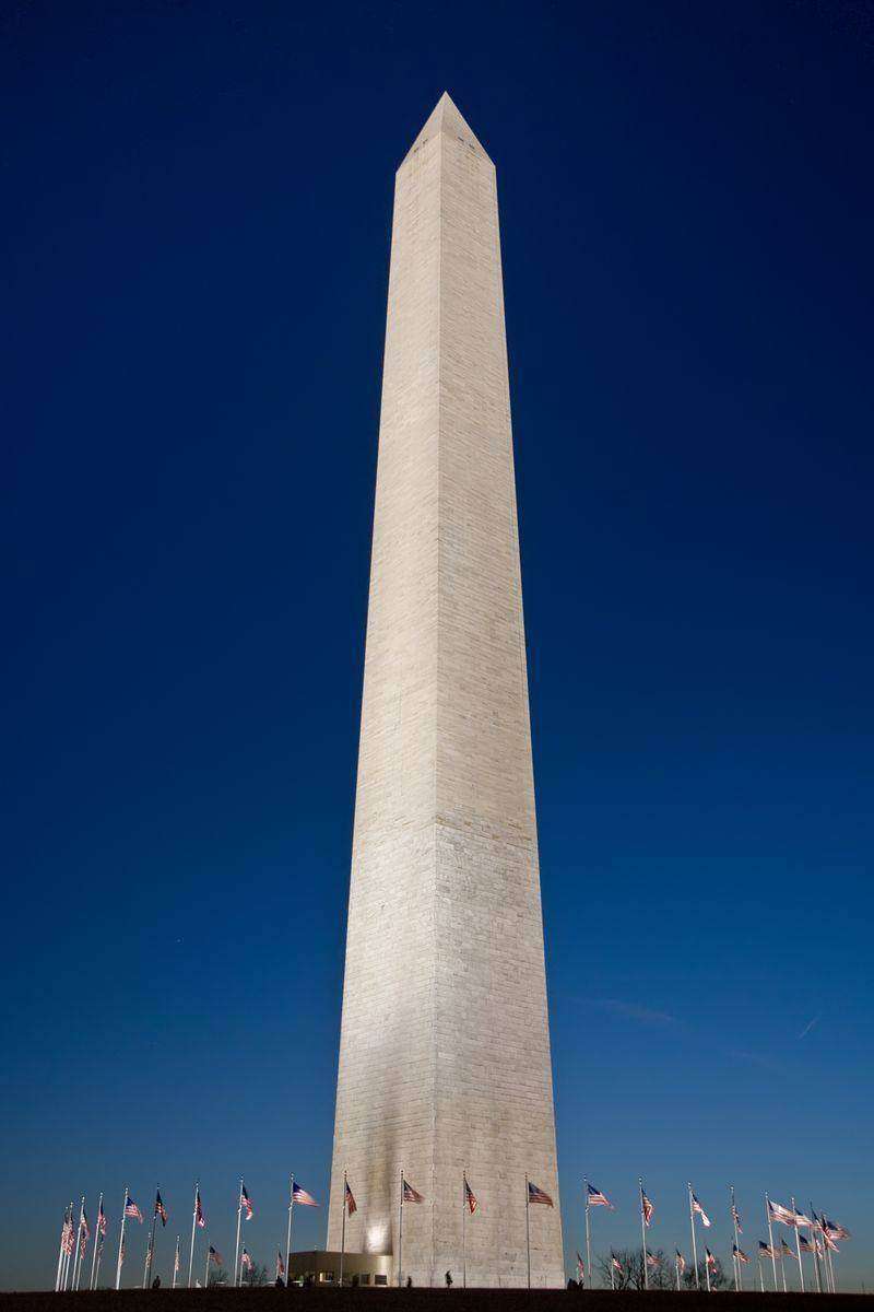 The Washington Monument rising over the National Mall with the ring of state flags